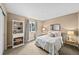 Bright bedroom featuring neutral walls, plush carpet, and a quaint window with peaceful outdoor views at 2575 Mccracken Ln, Castle Rock, CO 80104