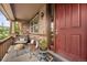 Charming front porch with cozy seating, stone accents, and a welcoming entrance at 2575 Mccracken Ln, Castle Rock, CO 80104