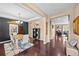 Open-concept floorplan showing dining room and hallway with hardwood floors and neutral decor at 2575 Mccracken Ln, Castle Rock, CO 80104