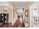 Spacious hallway with hardwood floors, neutral walls, and views of multiple rooms at 2575 Mccracken Ln, Castle Rock, CO 80104