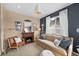 Cozy living room featuring a fireplace, comfortable seating, and a neutral color scheme at 2575 Mccracken Ln, Castle Rock, CO 80104