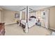 Another view of Main bedroom with four poster bed, hardwood floors, and natural light at 2575 Mccracken Ln, Castle Rock, CO 80104