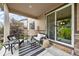 Relaxing patio with cushioned seating and sliding door access to the home at 2575 Mccracken Ln, Castle Rock, CO 80104