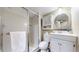 Bathroom featuring a vanity, toilet, and a glass-enclosed shower, offering comfort and style at 3755 Shefield Dr, Broomfield, CO 80020