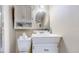 A bathroom featuring a vanity, toilet, and overhead cabinet, providing comfort and convenience at 3755 Shefield Dr, Broomfield, CO 80020