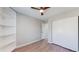 Bedroom with hardwood floors, built in bookcase and a large sliding closet at 3755 Shefield Dr, Broomfield, CO 80020