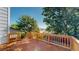 A wooden deck overlooking a fenced-in yard with lush trees offering privacy at 3755 Shefield Dr, Broomfield, CO 80020