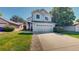 Charming two-story home with a well-manicured lawn and attached two-car garage at 3755 Shefield Dr, Broomfield, CO 80020