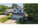 Charming two-story home with inviting front porch and well-maintained lawn at 3755 Shefield Dr, Broomfield, CO 80020