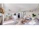 Bright open-concept living space with modern decor, fireplace, and dining area at 3755 Shefield Dr, Broomfield, CO 80020