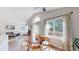 Cozy living space with lots of light, including a dining area, fireplace, and view to a deck at 3755 Shefield Dr, Broomfield, CO 80020