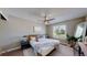 Comfortable main bedroom with hardwood floors, large window, and stylish decor at 3755 Shefield Dr, Broomfield, CO 80020