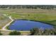 Picturesque pond with walking trail and lush green surroundings, offering serene views and outdoor recreation at 3755 Shefield Dr, Broomfield, CO 80020