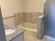 Clean bathroom with a bathtub and shower at 20971 E 42Nd Ave, Denver, CO 80249