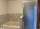 Bathroom with bathtub and shower at 20971 E 42Nd Ave, Denver, CO 80249