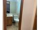 Small half bathroom with a sink and toilet at 20971 E 42Nd Ave, Denver, CO 80249