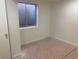 Unfinished basement bedroom with window and carpet at 20971 E 42Nd Ave, Denver, CO 80249