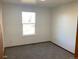 Bright bedroom with a window and carpet at 20971 E 42Nd Ave, Denver, CO 80249