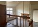 Two-story living room with a fireplace and loft view at 20971 E 42Nd Ave, Denver, CO 80249