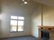 Living room with vaulted ceiling, fireplace and large window at 20971 E 42Nd Ave, Denver, CO 80249