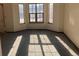 Spacious living room featuring bay windows and neutral carpet at 20971 E 42Nd Ave, Denver, CO 80249