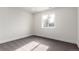 Cozy bedroom with neutral walls and carpet, providing a blank canvas with natural light for personalization at 855 Newark St, Aurora, CO 80010