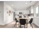 Bright kitchen and dining area with modern appliances, cabinets, and fixtures at 855 Newark St, Aurora, CO 80010