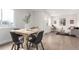 A dining room flows into a living room with hard wood floors and lots of light at 855 Newark St, Aurora, CO 80010