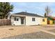 Charming single-story home featuring a gravel yard and a classic, welcoming facade at 855 Newark St, Aurora, CO 80010