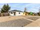 Charming home featuring gravel landscaping, a welcoming entry, and a well-maintained exterior at 855 Newark St, Aurora, CO 80010