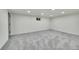 Finished basement with gray carpeting and recessed lighting at 6749 Ingalls St, Arvada, CO 80003