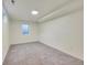 Finished basement room with gray carpet and a window at 6749 Ingalls St, Arvada, CO 80003