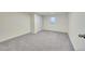 Finished basement room with gray carpet and a window at 6749 Ingalls St, Arvada, CO 80003