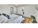 Spacious bedroom with en-suite bathroom and wood-look floors at 6749 Ingalls St, Arvada, CO 80003