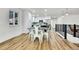 Bright dining area with hardwood floors and a view of the kitchen at 6749 Ingalls St, Arvada, CO 80003