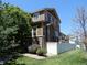 Exterior view featuring a well-maintained backyard, complemented by a white fence and tasteful landscaping at 7354 Benton St, Arvada, CO 80003