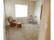 Bedroom featuring carpet and two chairs at 7354 Benton St, Arvada, CO 80003