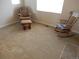 Comfortable bedroom with a chair, ottoman and rocking chair bathed in natural light from a bright window at 7354 Benton St, Arvada, CO 80003