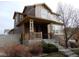 Beautiful two-story home with stone accents and a welcoming front porch at 7354 Benton St, Arvada, CO 80003