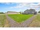 View of the back of the house and the spacious backyard, ideal for relaxation and outdoor enjoyment at 16500 Timber Cove St, Hudson, CO 80642