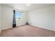 A cozy room that includes a window and carpeted floors offers comfort and functionality at 16500 Timber Cove St, Hudson, CO 80642