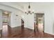 Dining space with hardwood floors and archways leading to other rooms, creating a seamless flow throughout the house at 16500 Timber Cove St, Hudson, CO 80642