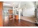 Well-appointed kitchen with hardwood floors, stainless steel appliances, and ample cabinet space for efficient meal preparation at 16500 Timber Cove St, Hudson, CO 80642