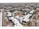 Aerial shot of a townhome community with a tennis court and greenery, perfect for active living at 6838 S Broadway, Centennial, CO 80122