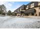 Backyard view showcasing well-maintained townhome exteriors and snow-dusted lawns, perfect for peaceful living at 6838 S Broadway, Centennial, CO 80122