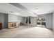 Spacious finished basement with a fireplace and a large sliding glass door providing access to the backyard at 6838 S Broadway, Centennial, CO 80122