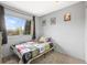 Bedroom featuring a bright window and quilted bedding for comfortable living at 6838 S Broadway, Centennial, CO 80122