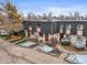 Street-level view of charming townhomes with landscaped lawns, creating an inviting curb appeal at 6838 S Broadway, Centennial, CO 80122