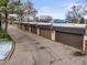 Detached garages with neutral colored doors and black trim for convenient and secure parking spaces at 6838 S Broadway, Centennial, CO 80122