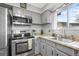 Bright, well-organized kitchen with stainless steel appliances and natural light at 6838 S Broadway, Centennial, CO 80122